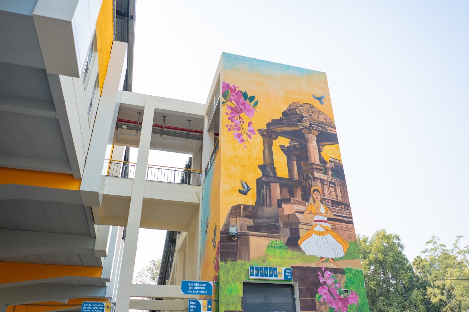 Mural of a classical dancer at a heritage temple site, painted on a station wall at Juna Sachivalaya metro station