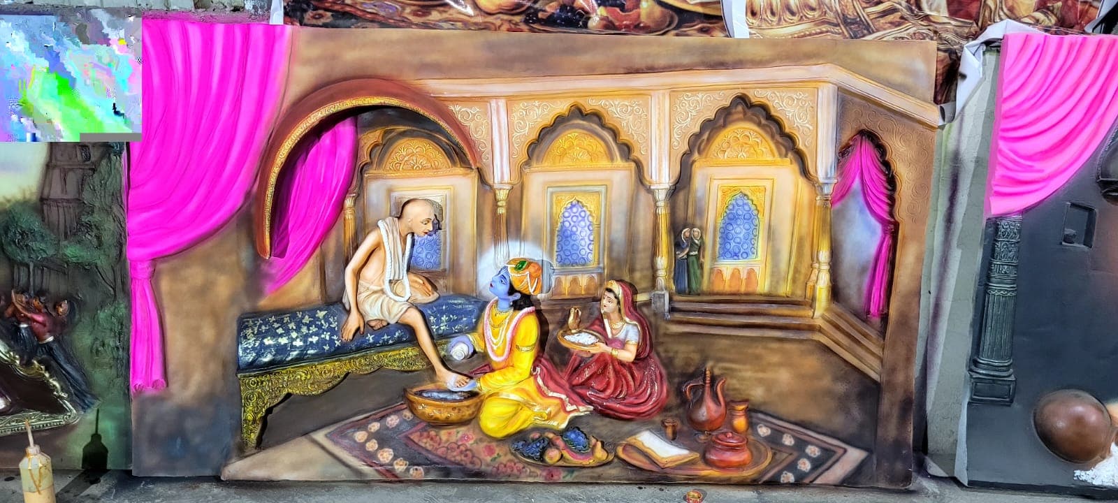 FRP relief panel depicting a palace scene of Krishna washing a devotee's feet