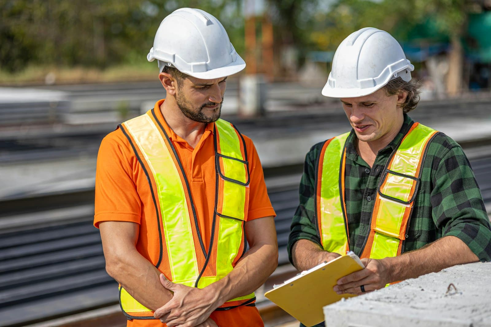 Construction team reviewing project plans on site